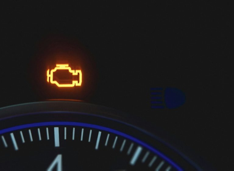 the dashboard of a car with the check engine light on