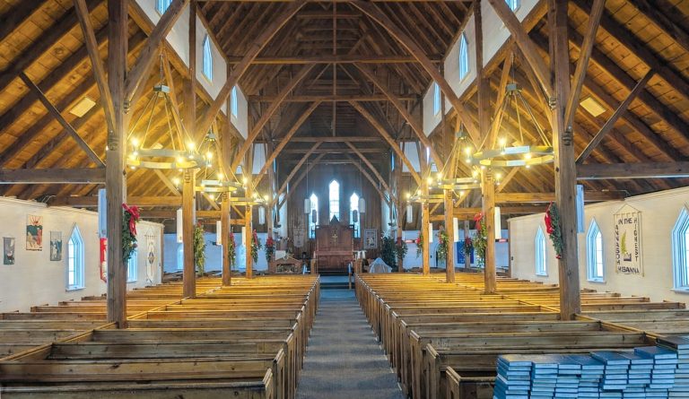 The interior of a large wooden Anglican Church