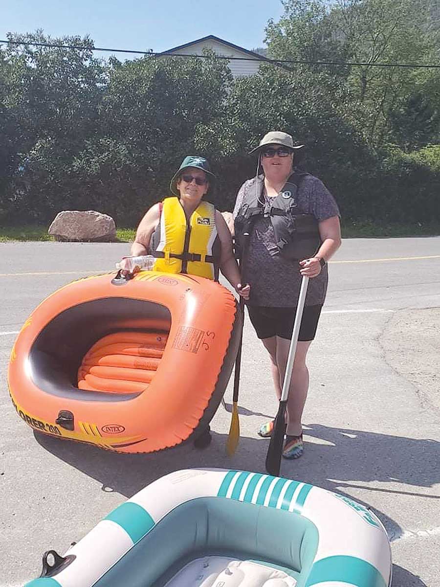 The Very Rev’d Catherine Short (left) and her friend and fellow priest, the Rev’d Tanya White, with the rafts and “one paddle each” that they had on their journey down the Humber River this past September.