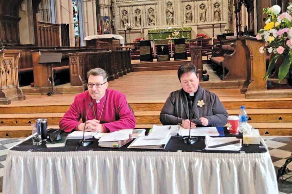 Archdeacon Taylor and Bishop Rose at the "head table" in the Anglican Cathedral of St. John the Baptist, leading Synod, February 25-26, 2022