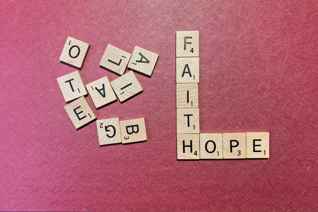 Scrabble pieces spelling out Faith and Hope