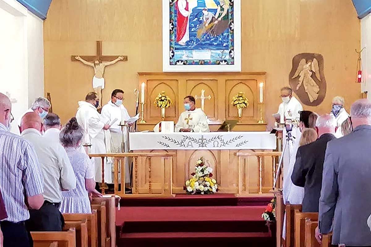 at the altar, are (left to right): Rev’d Canon Jeffrey Petten, Rev’d Edward Coleman, Bishop John Organ, and Archdeacon David Taylor.