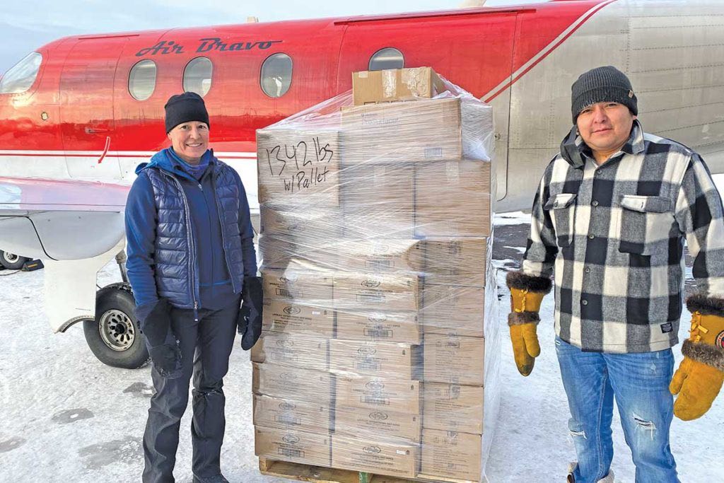 Amy Abbink and Titus Semple with the air shipment to Kingfisher Lake