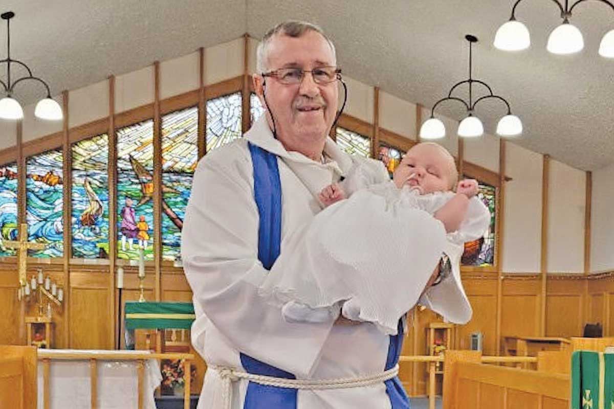 Tom Simms, who had just completed his first baptism: his great-granddaughter 