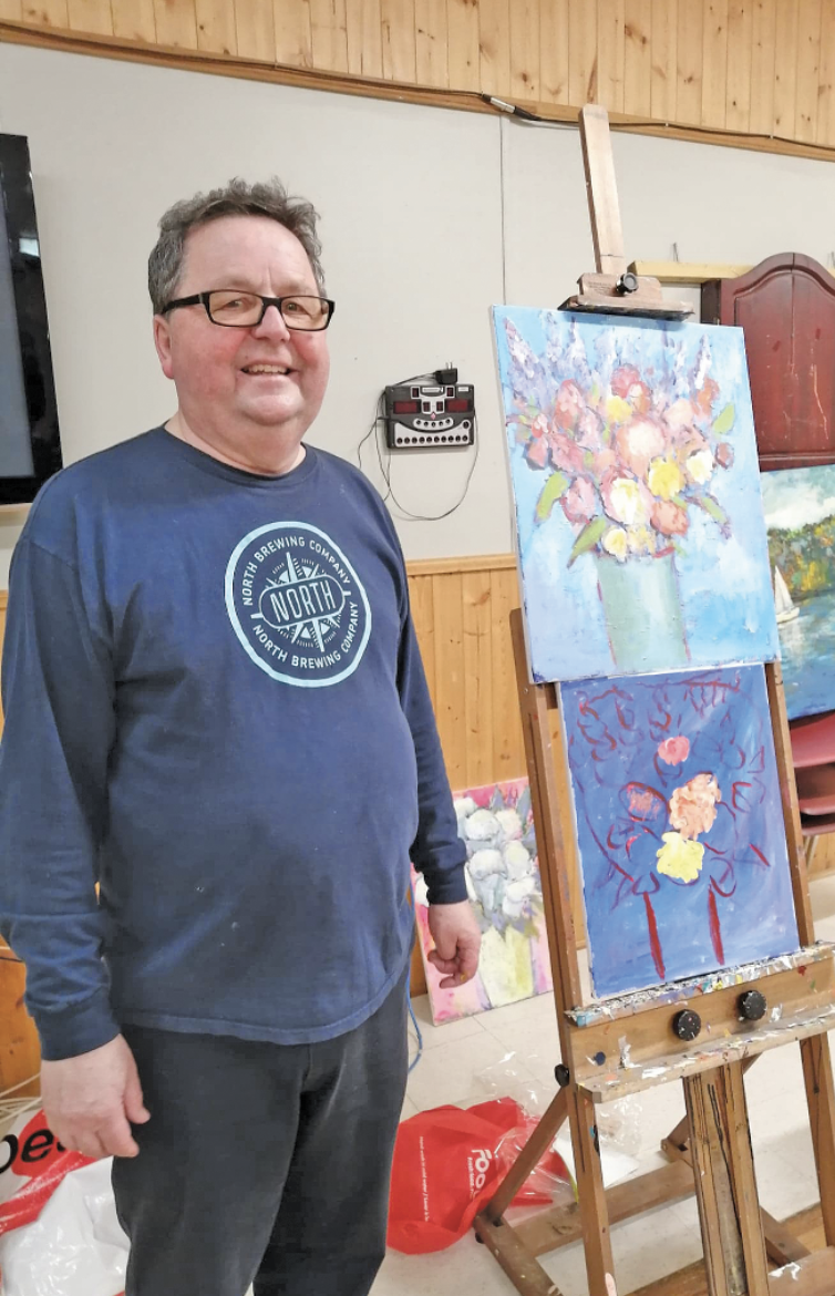 The Rev'd Ed Coleman with the painting for the event